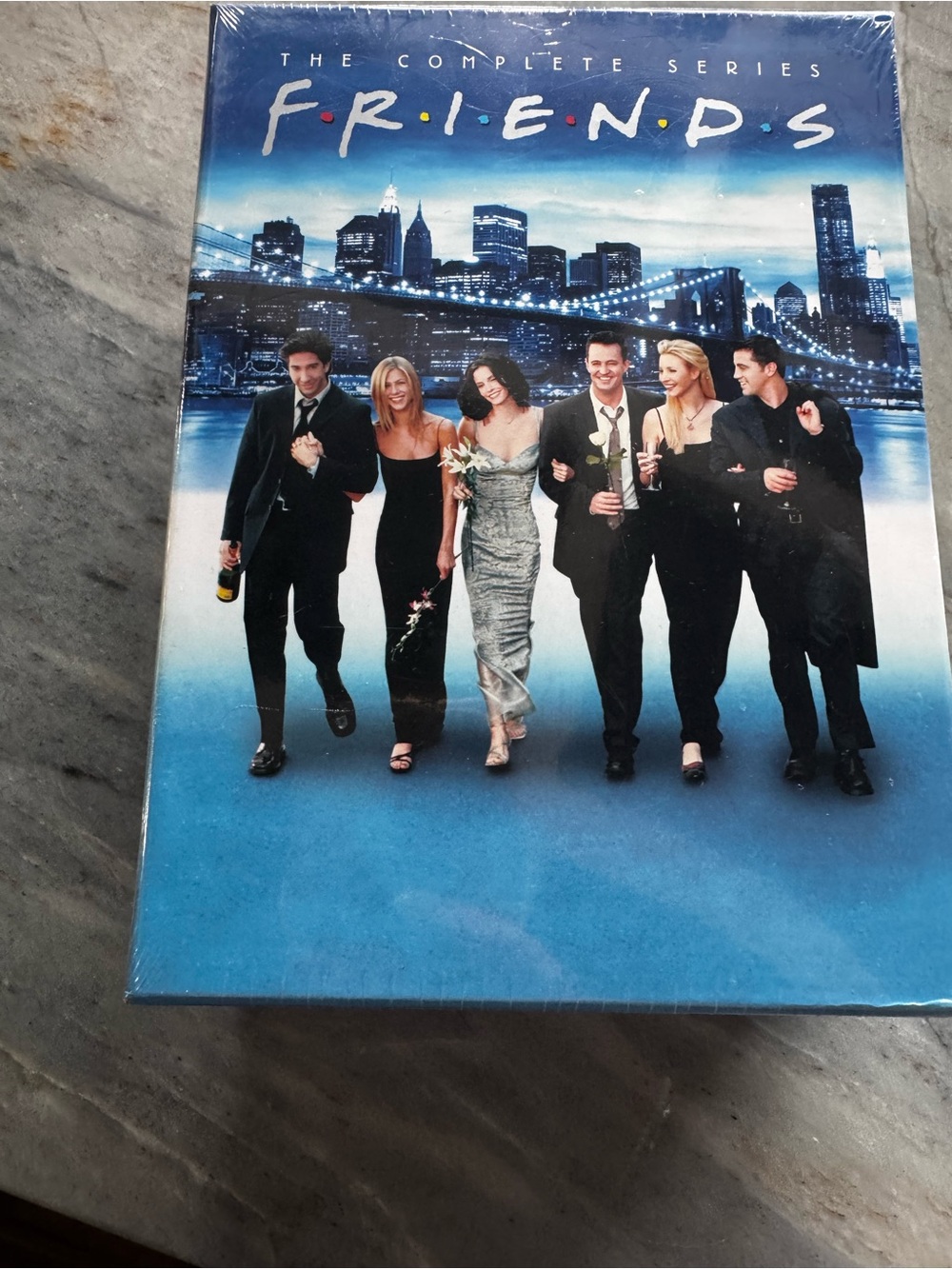 FRIENDS Men's Suit-Themed Cover Art in Blue and Black